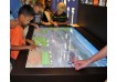 Mono 65" Custom MultiTouch Table in Museum with up to 100 simultaneous touch points using Advanced IR or PCap (Projected Capacitive) Touch Technologies